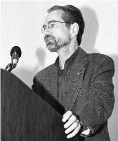 Allen Davenport speaking from a podium