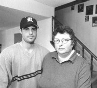 Maryellen with her son, who is wearing a baseball cap