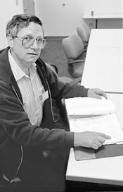 Don Thomassen pointing to a report.