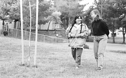 Wren and Mria walking in a park