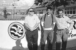 Jess Moreno standing by an emblem proclaiming Andrew Hill a distinguished School