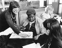 teacher helping students
